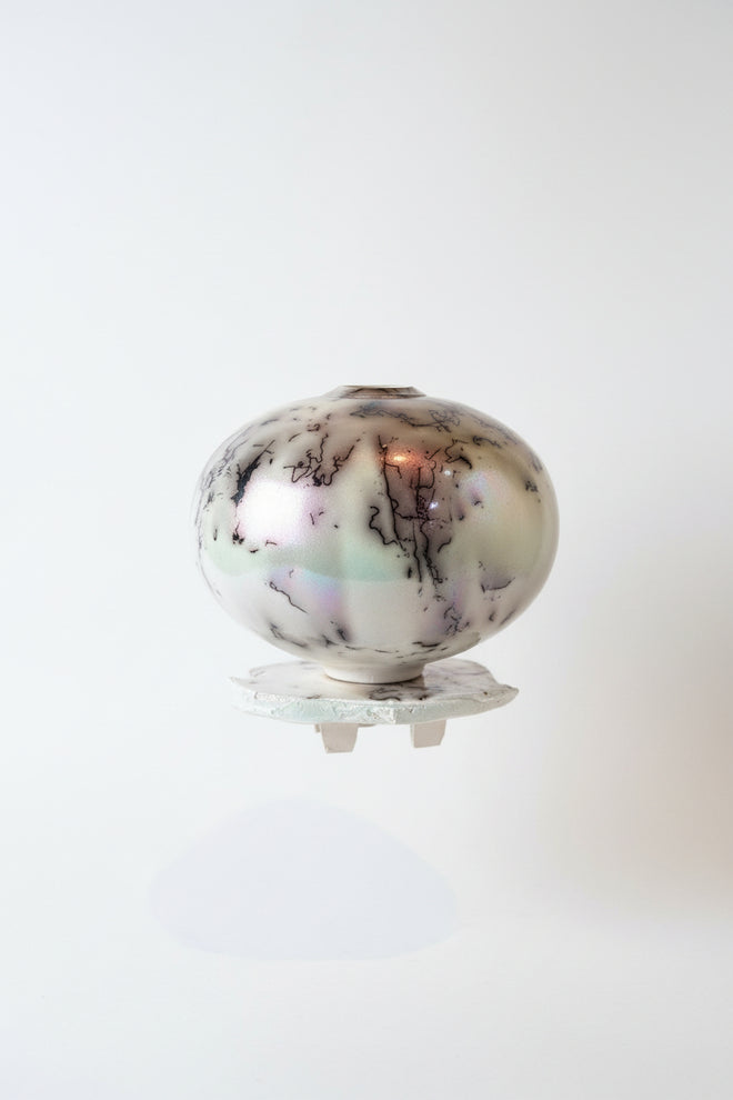 White Horsehair Raku Vessel on Altar – Opalescent Glazed Ceramic Vessel by Bob Smith