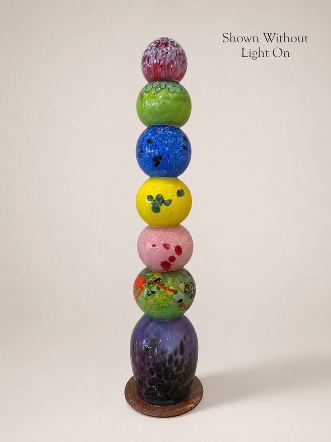 26 inch handblown glass light tower shown without light on to show the original glass colors