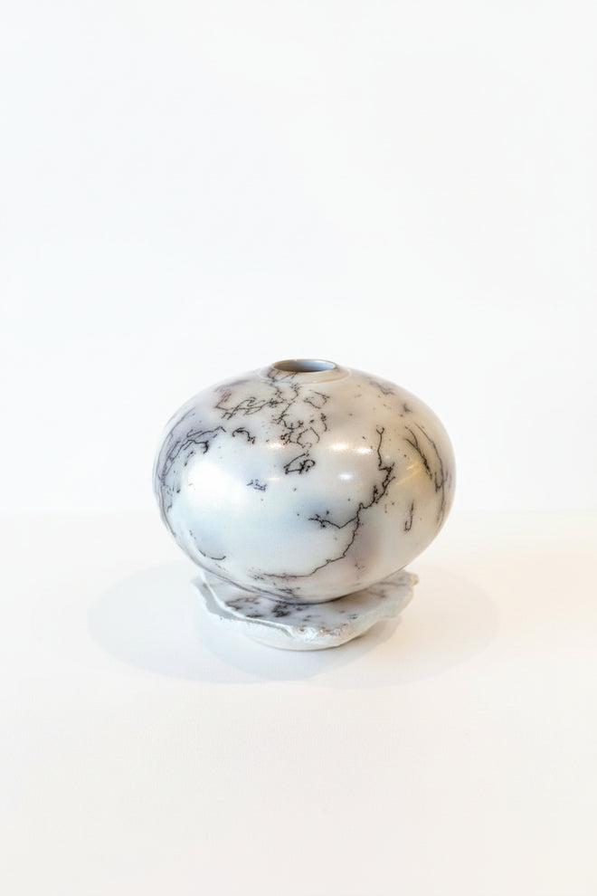 White Horsehair Raku Vessel on Altar – Opalescent Glazed Ceramic Vessel by Bob Smith
