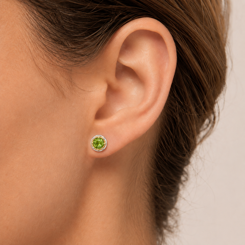 6mm peridot stud earrings on model