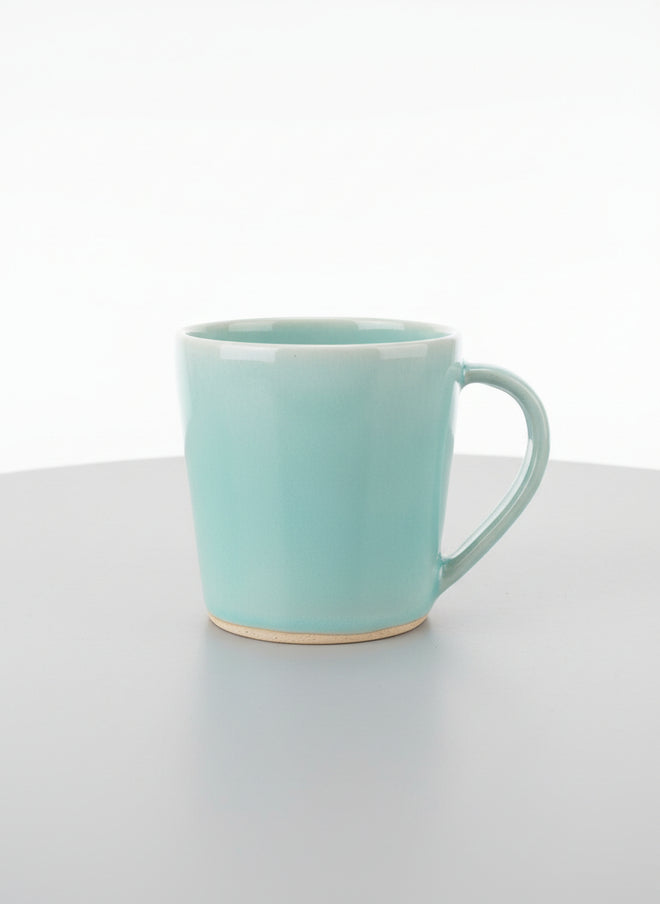 Handmade Aqua Ceramic Cup by Corinne De Haas