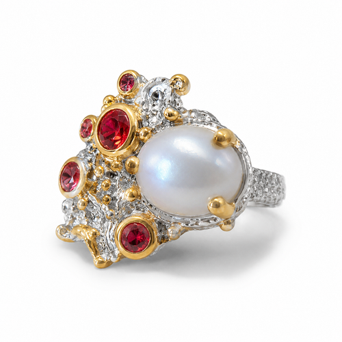Luxury pearl and sapphire cluster ring displayed in elegant lighting, highlighting the unique handcrafted details and gemstone brilliance.