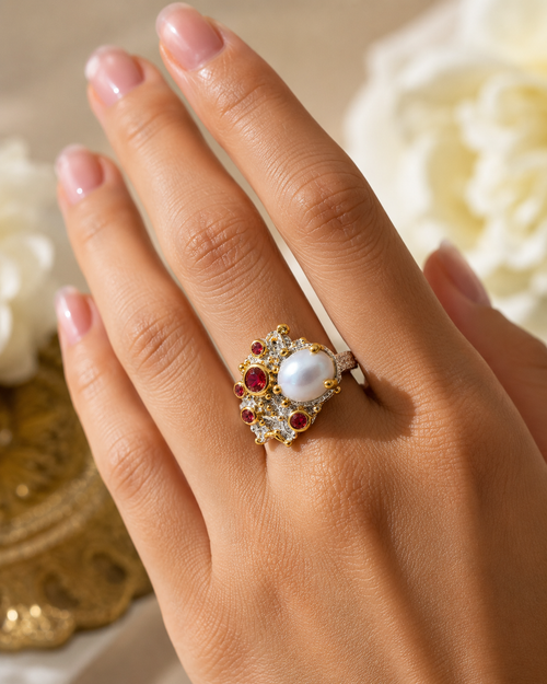 Pearl sapphire cluster statement ring worn on hand, showcasing an organic artisan design with a luminous pearl centerpiece.