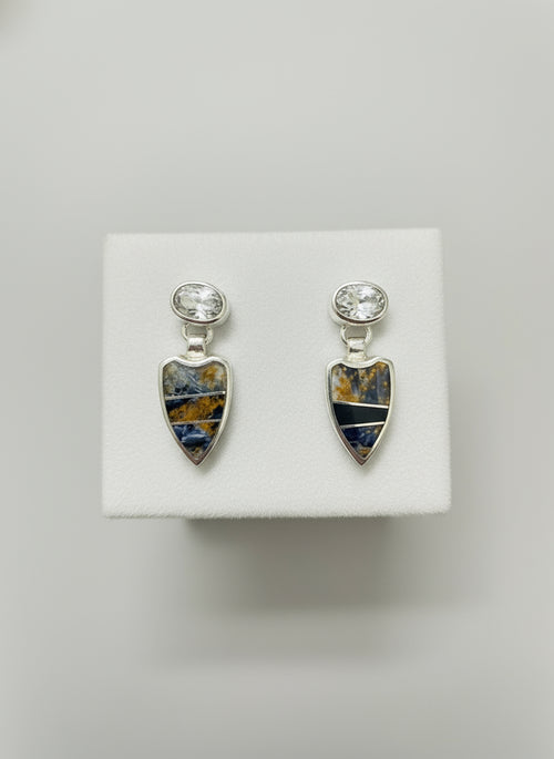 A pair of sterling silver earrings featuring Pietersite and Cubic Zirconia inlay, displayed against a black background.