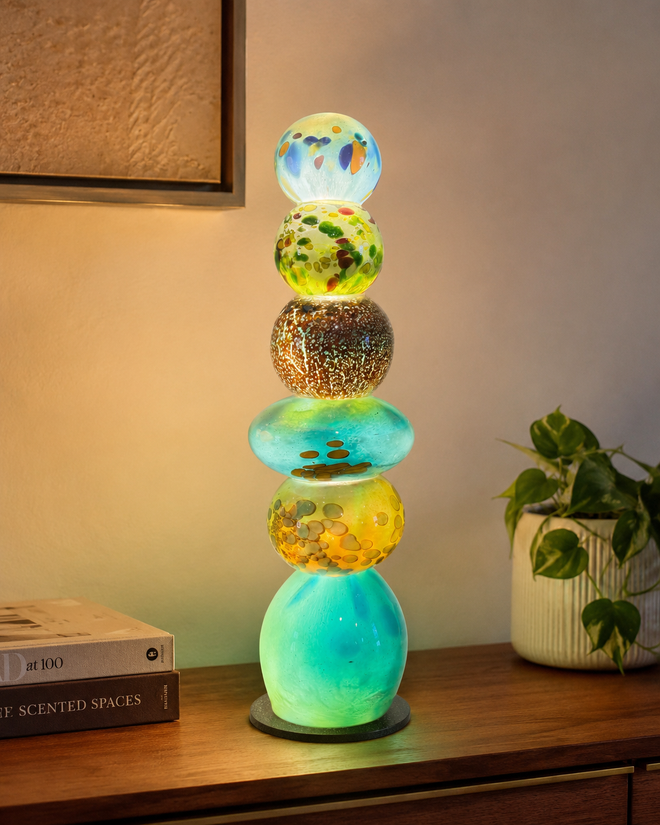 Aqua handblown glass light tower displayed as colorful art lighting for home decor