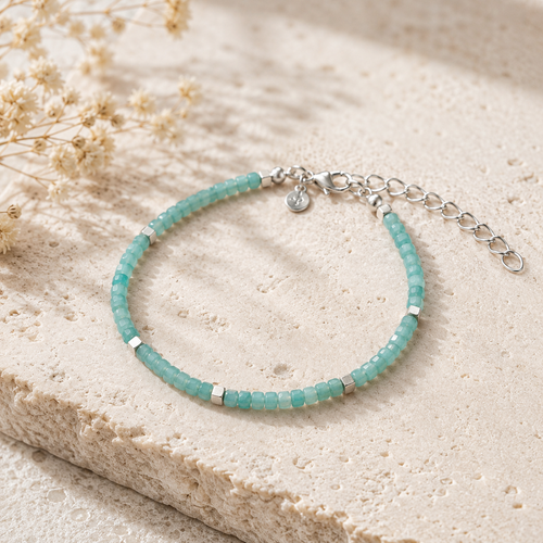 Luxury handmade Amazonite beaded bracelet with faceted natural gemstones, matte sterling silver cube accents, and adjustable sterling silver clasp.