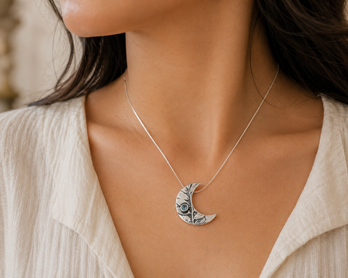 Handmade artisan aquamarine moon necklace worn elegantly handcrafted in Sedona Arizona sterling silver jewelry