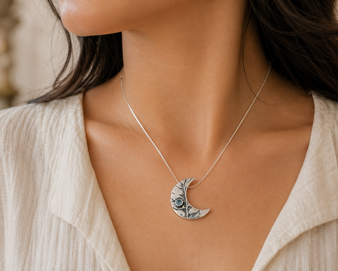 Handmade artisan aquamarine moon necklace worn elegantly handcrafted in Sedona Arizona sterling silver jewelry