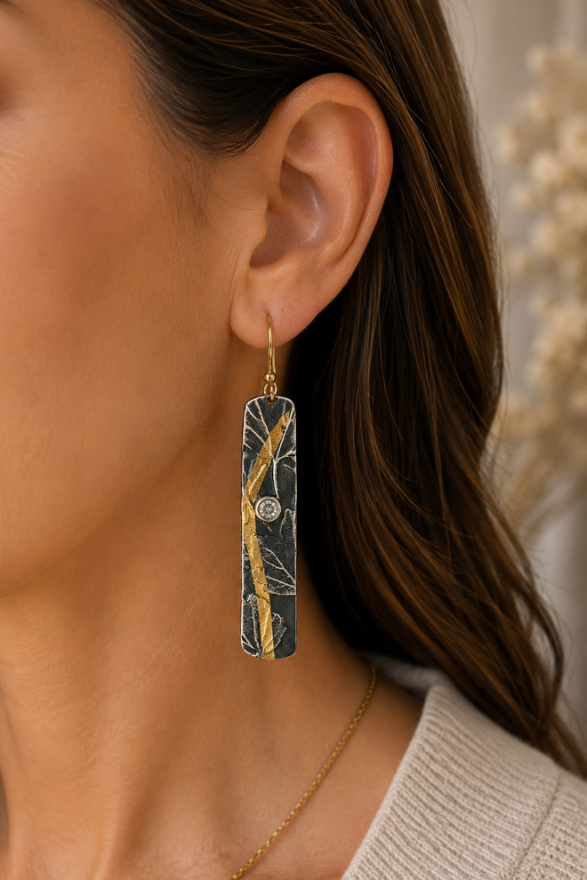 Handmade artisan sterling silver bar earrings worn elegantly handcrafted in Sedona Arizona with gold accents and cubic zirconia