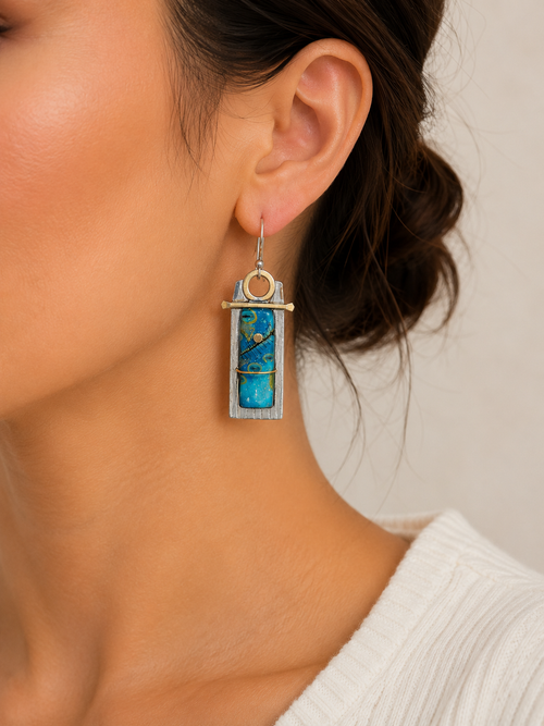 Turquoise-blue art glass artisan earrings shown on model ear, lightweight handmade sterling silver and brass dangle earrings.