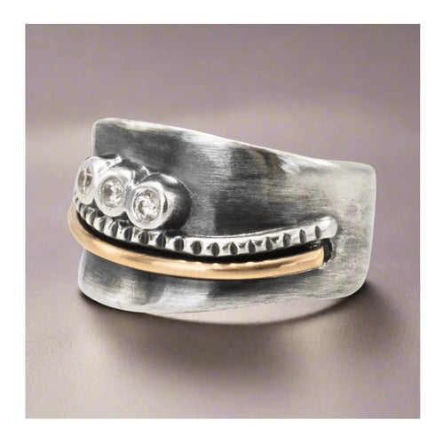 Artisan mixed metal flare ring with twisted silver rope detail