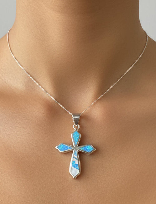 Authentic Navajo Blue Opal and Mother of Pearl cross pendant handcrafted in sterling silver, Native American stone inlay jewelry with sterling silver snake chain from Raku Gallery.