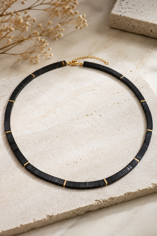 Handmade 18-inch black hematite necklace featuring 6x6mm square hematite beads with 18K gold-plated sterling silver accent beads on a white jewelry display. Elegant minimalist statement necklace for women.