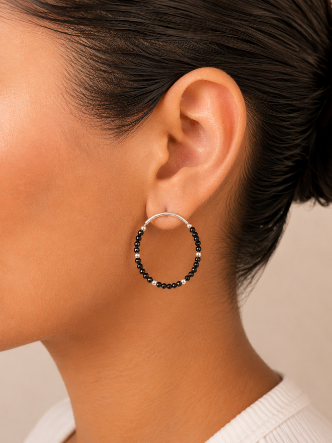 Modern sterling silver hoop earrings with genuine black spinel gemstone beads and satin matte silver finish, handcrafted luxury earrings for everyday wear.