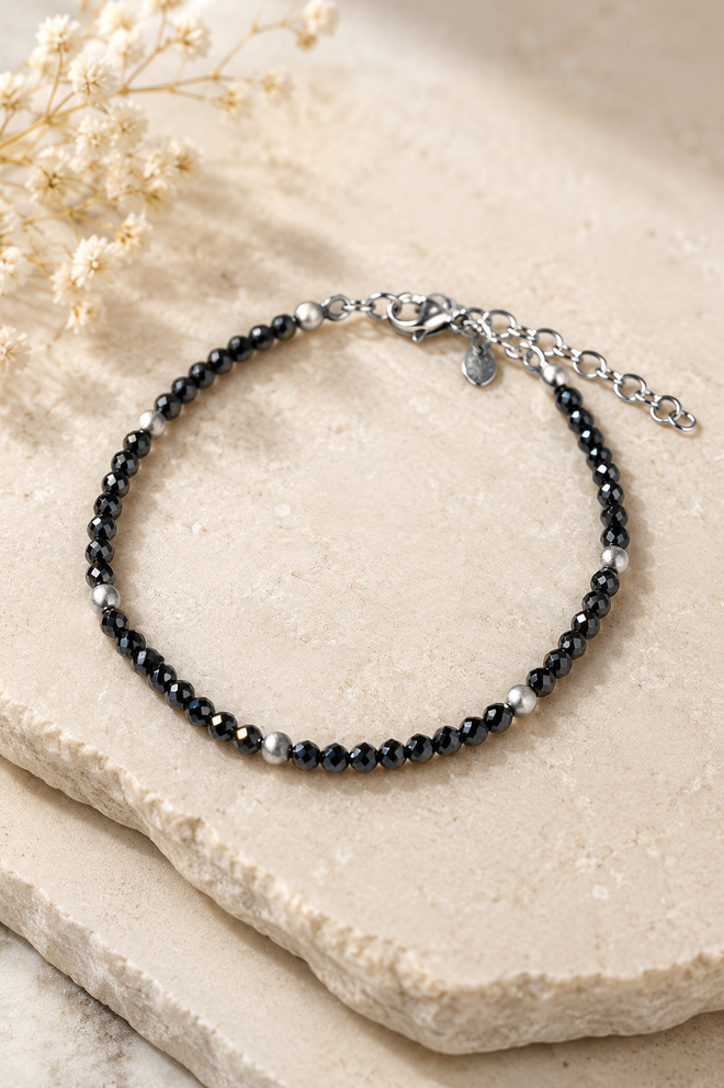 Handcrafted black spinel bracelet with faceted 3mm natural black spinel gemstones, matte sterling silver beads, and an adjustable sterling silver extension chain.