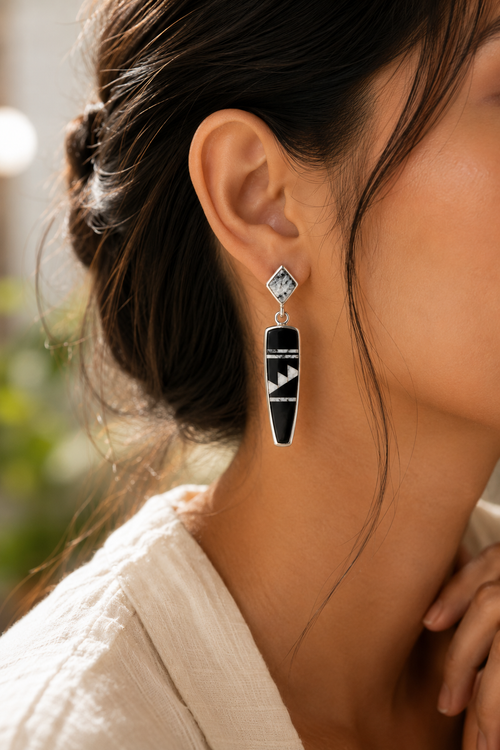 Black and white Native American stone inlay drop earrings shown on ear