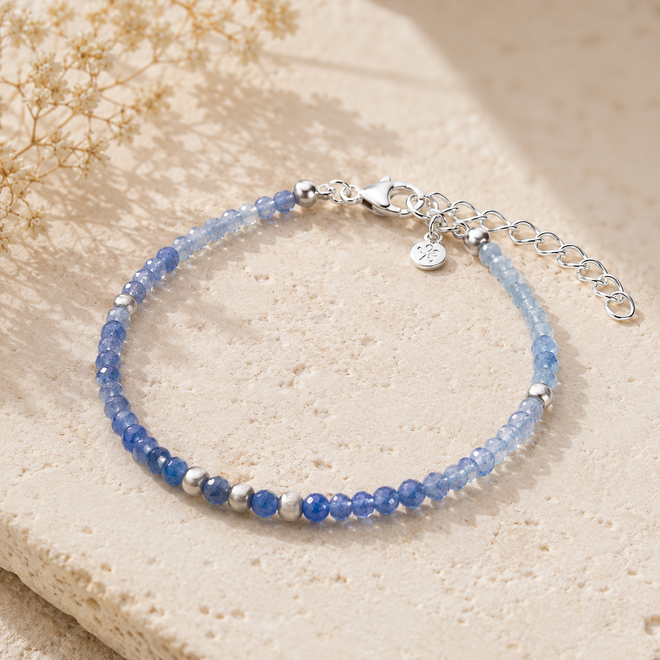 Handcrafted blue aventurine bracelet featuring natural faceted blue aventurine gemstones, matte sterling silver beads, and an adjustable sterling silver extension chain.
