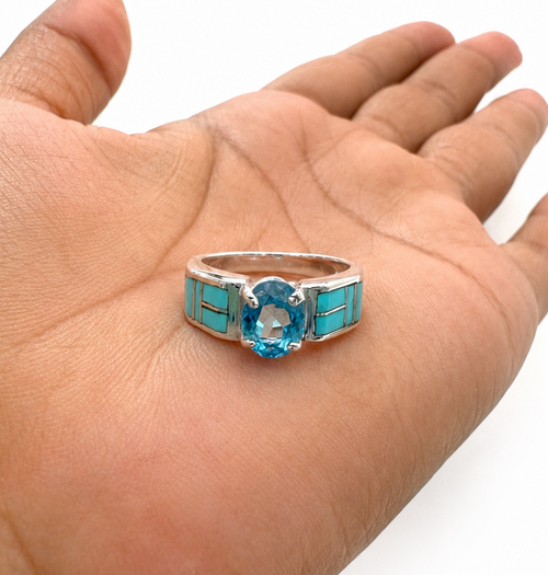 Detailed view of the blue topaz center stone and Kingman Arizona turquoise inlay in an authentic Navajo handcrafted ring.