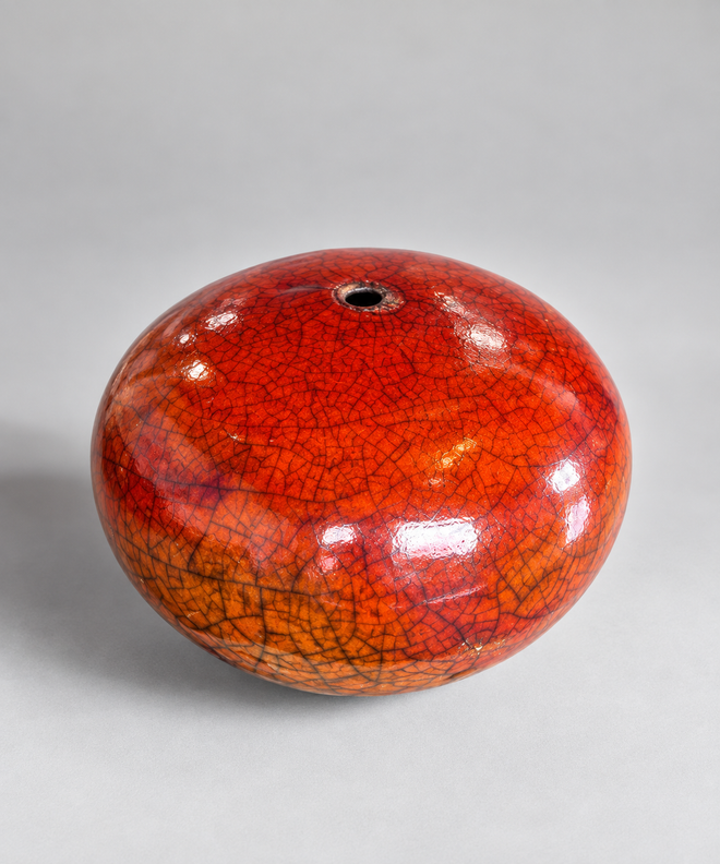 Bob Smith ferric chloride Raku orb vessel created with a rare firing technique, featuring fiery red-orange crackle glaze and smoke markings