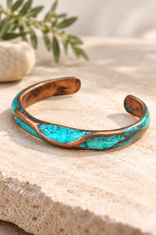 Slim handmade copper patina cuff bracelet by Sedona artist Chikako Myers with turquoise-blue and green finish.