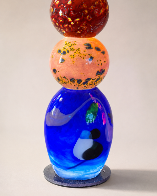 Close up of cobalt blue base and lower glass details on a handblown glass light tower