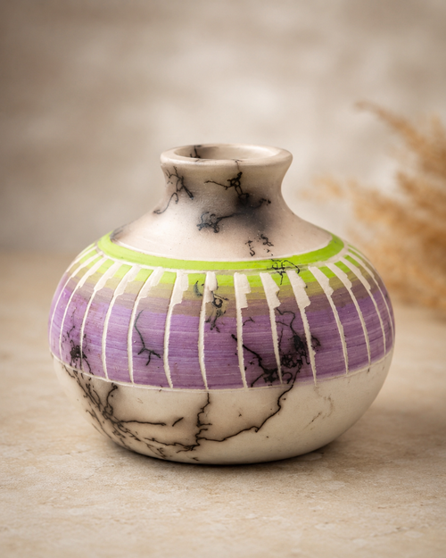 Collectible Navajo etched pottery vase by Larry Livingston. Handmade Arizona ceramic art featuring carved detailing, horsehair firing, and elegant lavender and green accents.