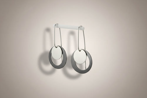 Contemporary drop earrings with dark oxidized sterling silver circles and polished silver discs