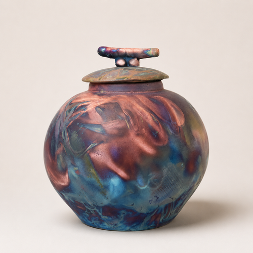 One-of-a-kind copper blue Raku pottery vessel handmade in Arizona with metallic violet and smoky fired finish