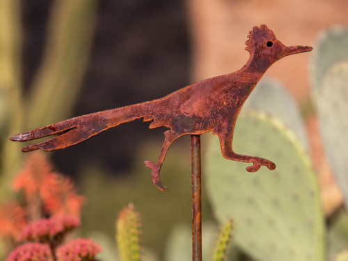 Close-up of handmade rustic steel Roadrunner garden stake craftsmanship