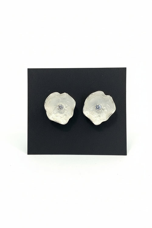 Designer sterling silver flower stud earrings with brilliant cubic zirconia, handcrafted artisan jewelry with a modern organic style.