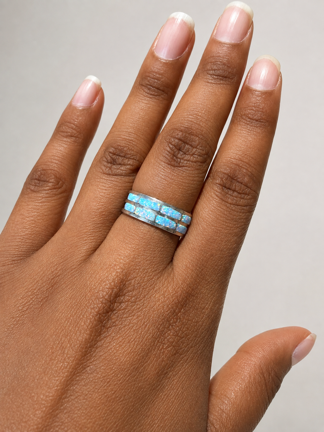 ouble row white cultured opal inlay ring in sterling silver shown on hand