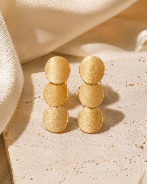 Gold plated sterling silver curved disc drop earrings in a luxury setting