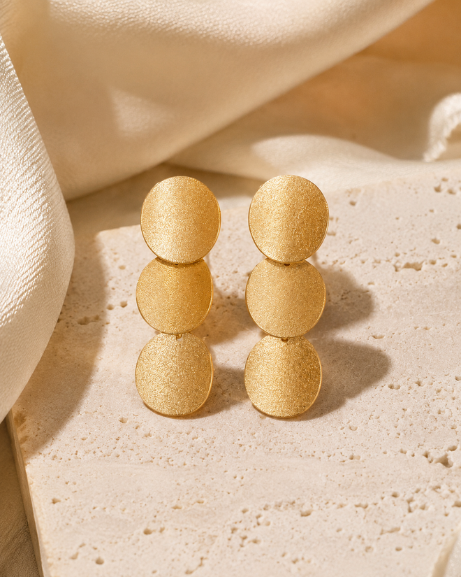 Gold plated sterling silver curved disc drop earrings in a luxury setting