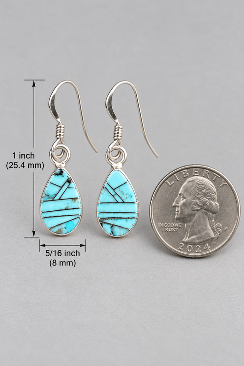 Golden Hills turquoise inlay earrings shown beside a US quarter for size reference, measuring approximately 1 inch long and 5/16 inch wide.