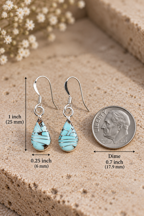 Golden Hills turquoise silver earrings shown with a US dime and measurements of 1 inch in length and 1/4 inch in width for size reference.