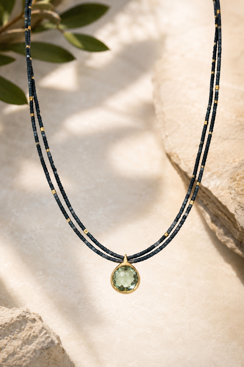 Handmade Green Amethyst pendant necklace featuring a double strand of 1.5mm square hematite beads, gold-plated accent beads, and a gold-plated sterling silver pendant with a magnetic clasp.
