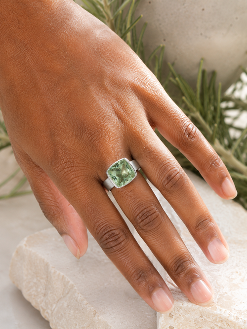 Handmade green amethyst sterling silver ring shown on hand