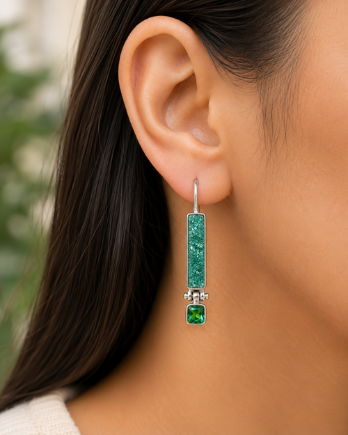 Model wearing one-of-a-kind Green Druzy and Chrome Tourmaline sterling silver earrings showing their elegant 1.375-inch drop.