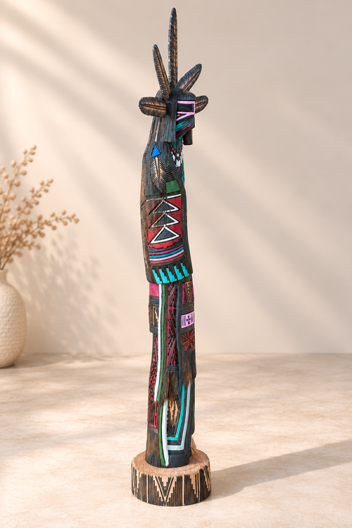 Side view of hand-carved Navajo Kachina cottonwood sculpture by Jerold Guy showing intricate geometric details