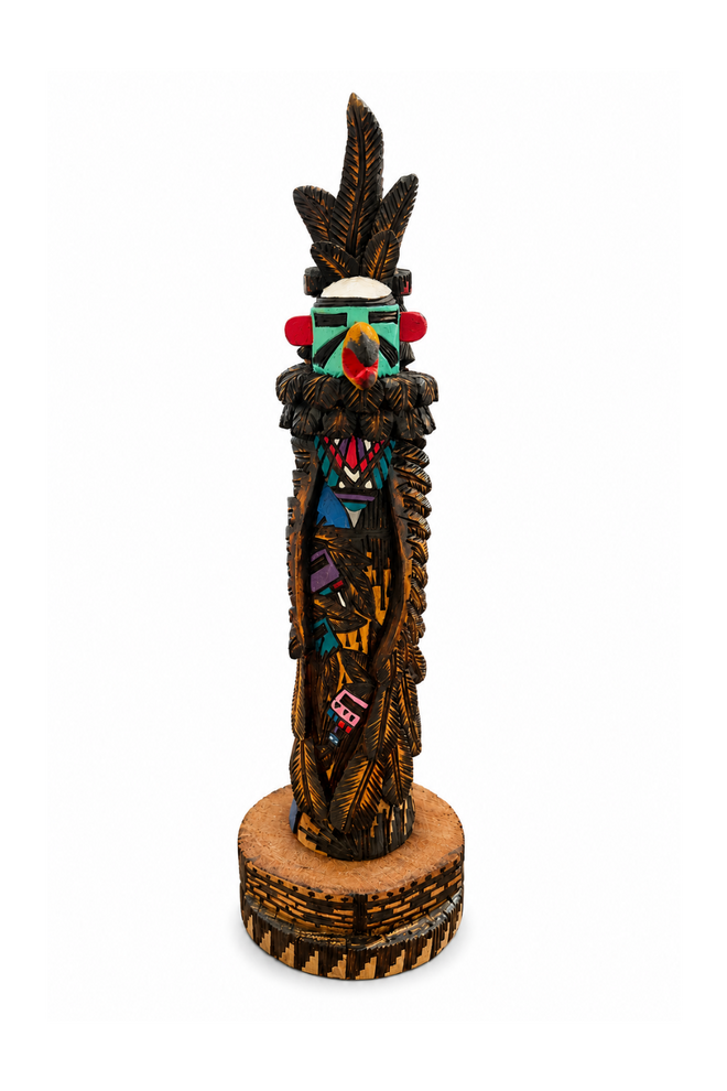 Hand-carved Raven Kachina sculpture by Navajo artist Jerald Guy featuring intricate burned-line carving, vibrant hand-painted details, and authentic cottonwood craftsmanship.