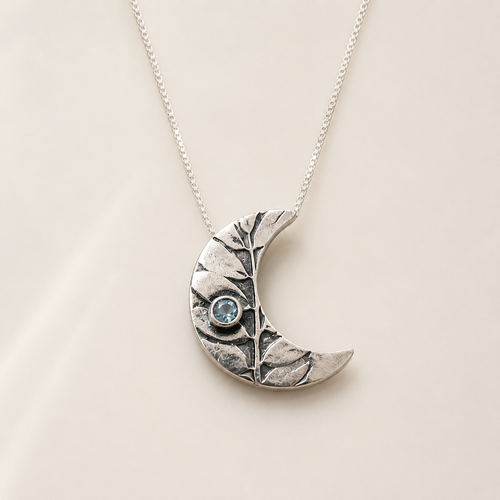 One-of-a-kind handmade crescent moon necklace with aquamarine in sterling silver handcrafted in Sedona Arizona artisan jewelry