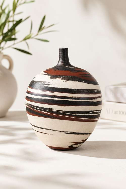 Handmade Arizona swirl pottery vase by Sari Green with natural white, charcoal and rust-colored clay layers