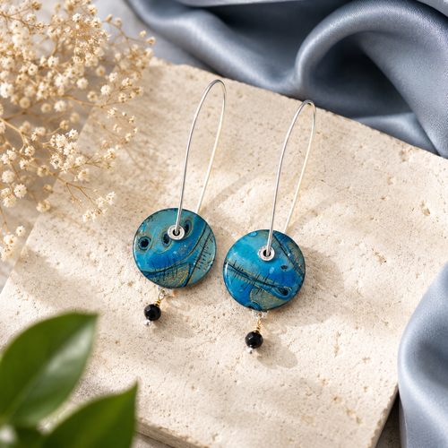 Blue sterling silver dangle earrings featuring handcrafted blue art glass and delicate accent beads.