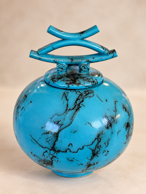 Top View - Handmade blue turquoise horsehair raku pottery vessel with glossy finish and black natural markings