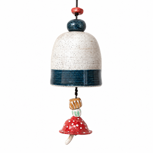 Handmade ceramic mushroom bell with red spotted mushroom charm and blue glazed accents on white background