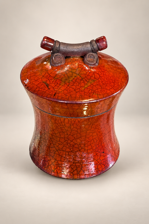 Handmade ferric chloride raku ceramic lidded vessel with orange crackle finish