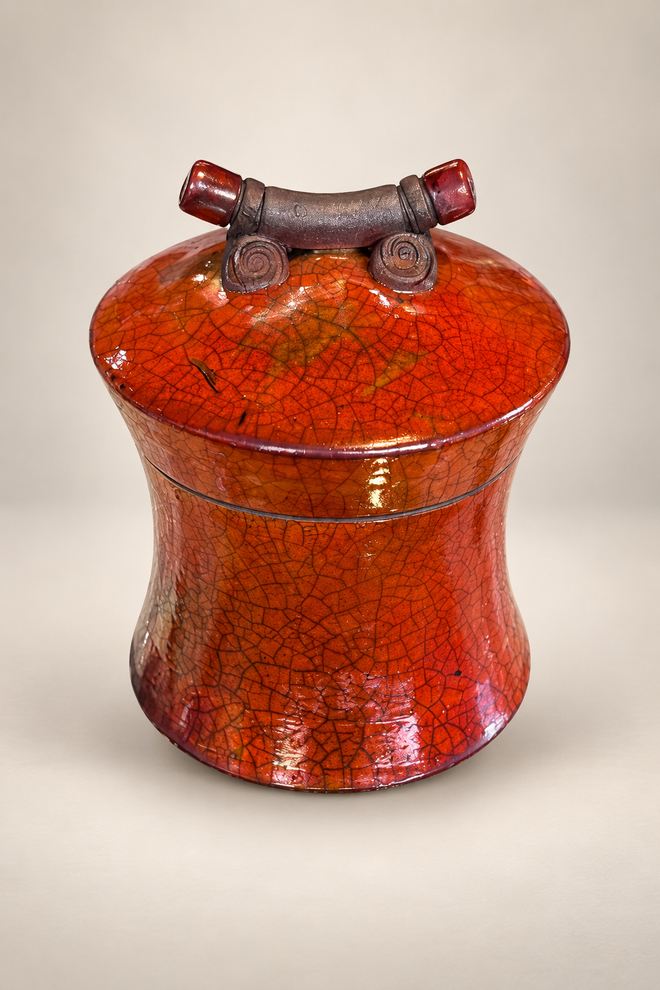 Handmade ferric chloride raku ceramic lidded vessel with orange crackle finish