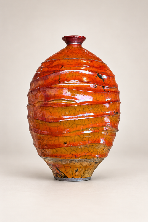 Handmade ferric chloride raku vase with rich orange crackle glaze and sculptural textured surface