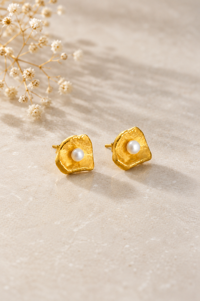Handmade gold vermeil shell stud earrings with genuine freshwater pearls, artisan sterling silver jewelry inspired by the beauty of the ocean and coastal elegance.