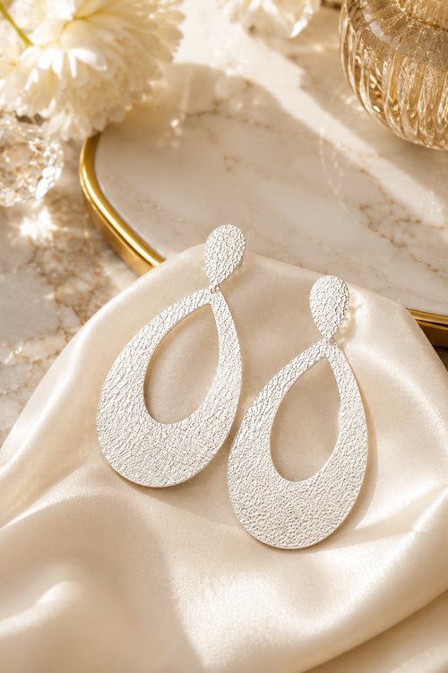 Handmade hammered sterling silver statement earrings, lightweight 2-inch open drop earrings with a contemporary artisan design.